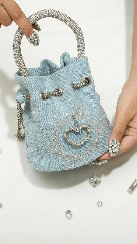 Suede bucket bag in a pastel color for a soft and feminine aestheticDenim bucket bag with heart charm