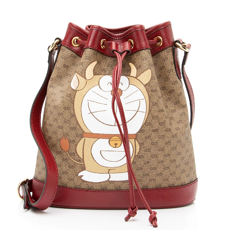 Convertible bucket bag that can be worn as a cross - body or shoulder bagGucci x Doraemon Micro GG Canvas Mini Bucket Bag