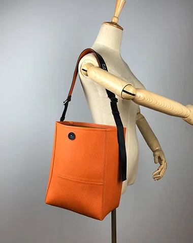 Bucket bag with a tassel or fringe detail for a bohemian feelLarge Womens Orange Leather Shoulder Barrel Tote Bag Bucket Tote Handbag Purse Work Bag for Ladies