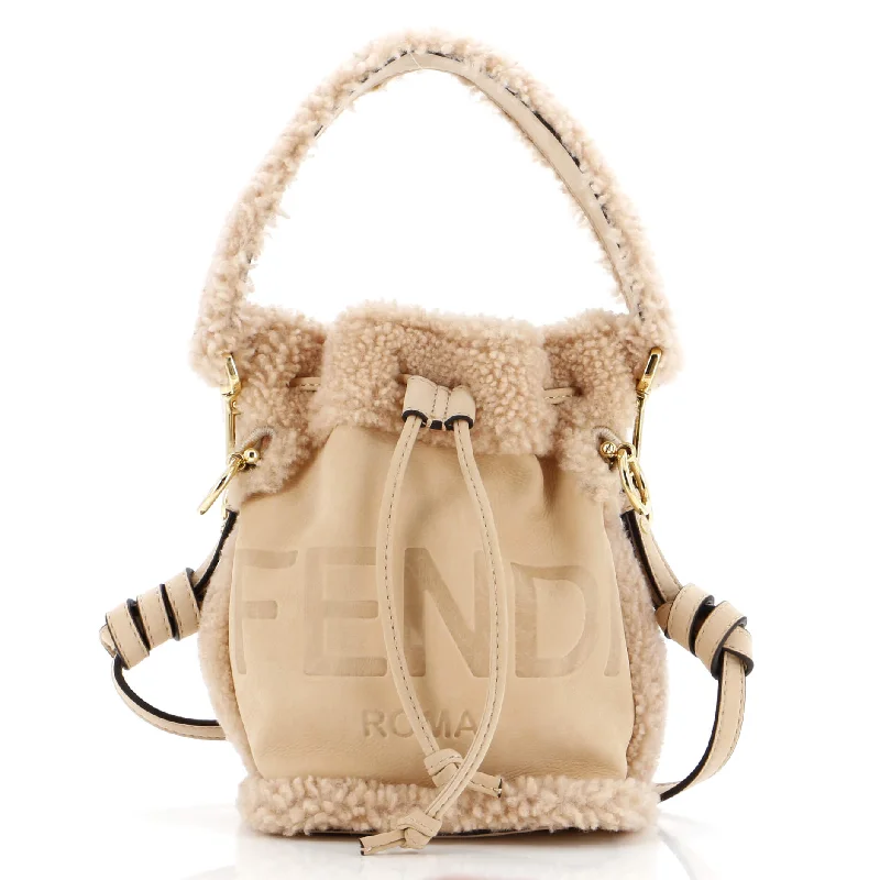 Convertible bucket bag that can be worn as a cross - body or shoulder bagLogo Mon Tresor Bucket Bag Shearling with Nubuck Mini