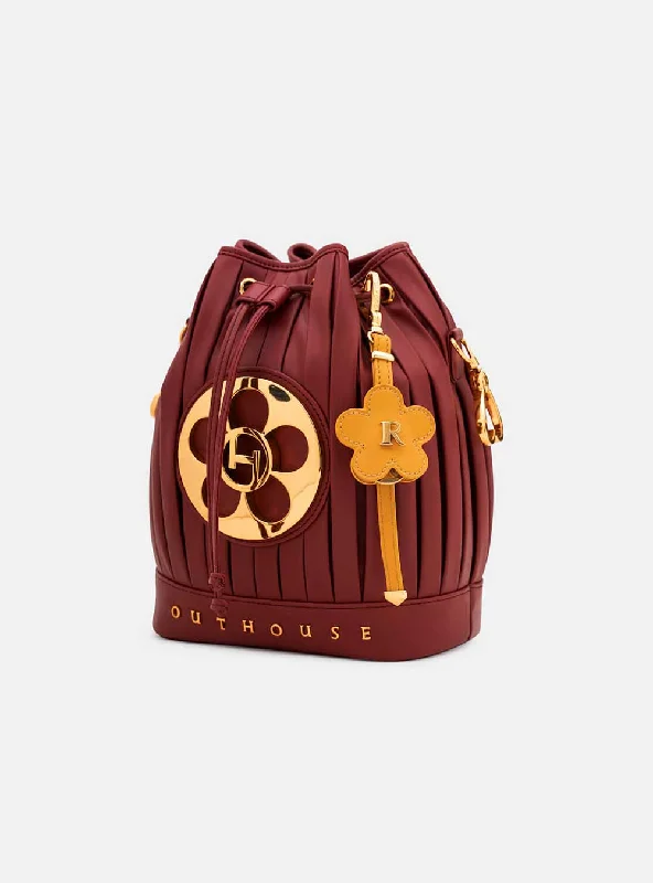 Studded bucket bag with a punk - rock vibeOH Poppi Bucket Bag in Rosewood Maroon