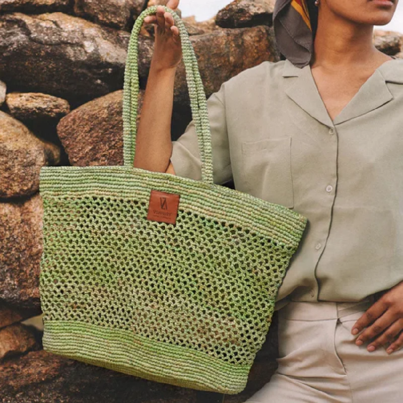 Suede bucket bag in a pastel color for a soft and feminine aestheticArya Woven Raffia Bucket Bag