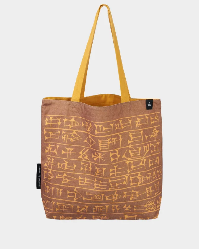 Tote bag with a tassel or fringe detail for a bohemian styleCuneiform Canvas Shoulder Tote