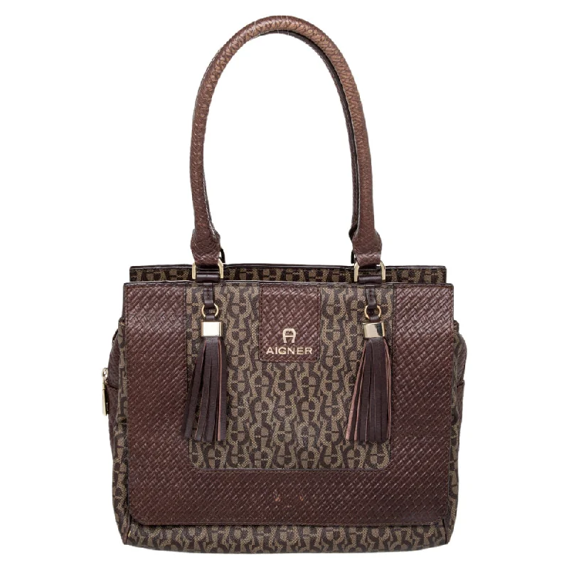 Soft suede satchel in a rich burgundy color for autumnAigner Signature Canvas And Leather Tassel Satchel