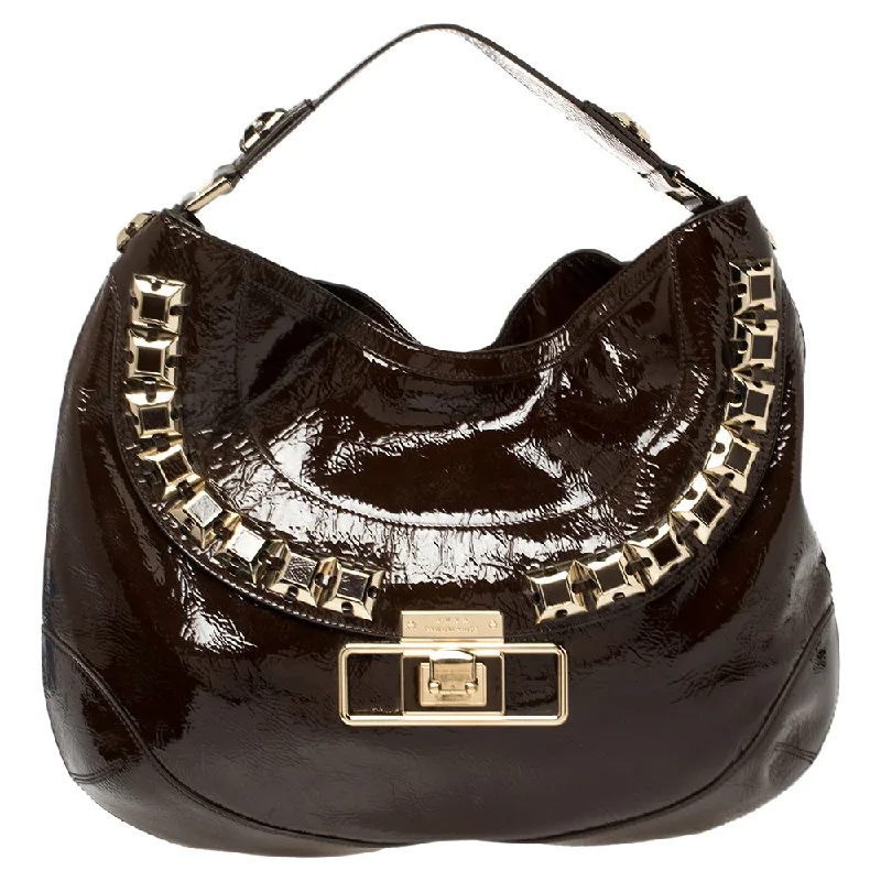 Satchel with a hidden anti-theft pocket for securityAnya Hindmarch Dark Patent Leather Studded Hobo