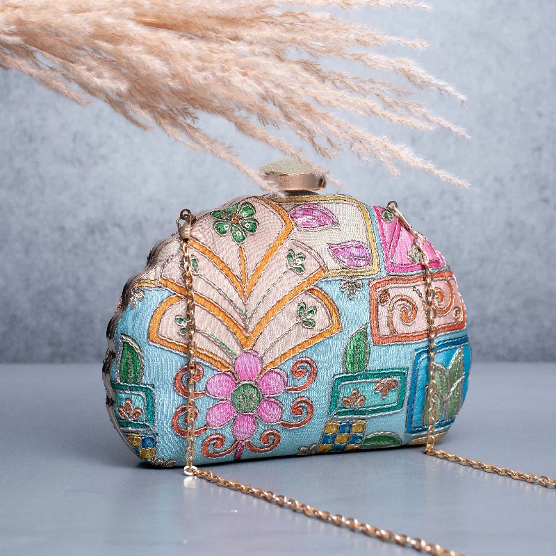 Laser - cut leather evening bag with an intricate patternArtklim Blue Based Multicolored Pattern Printed Golden Zari Embroidery Clutch