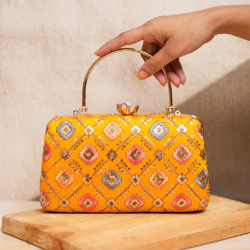 Clutch with a removable strap to be used as a hand - held or cross - bodyArtklim Yellow Embroidered Party Clutch