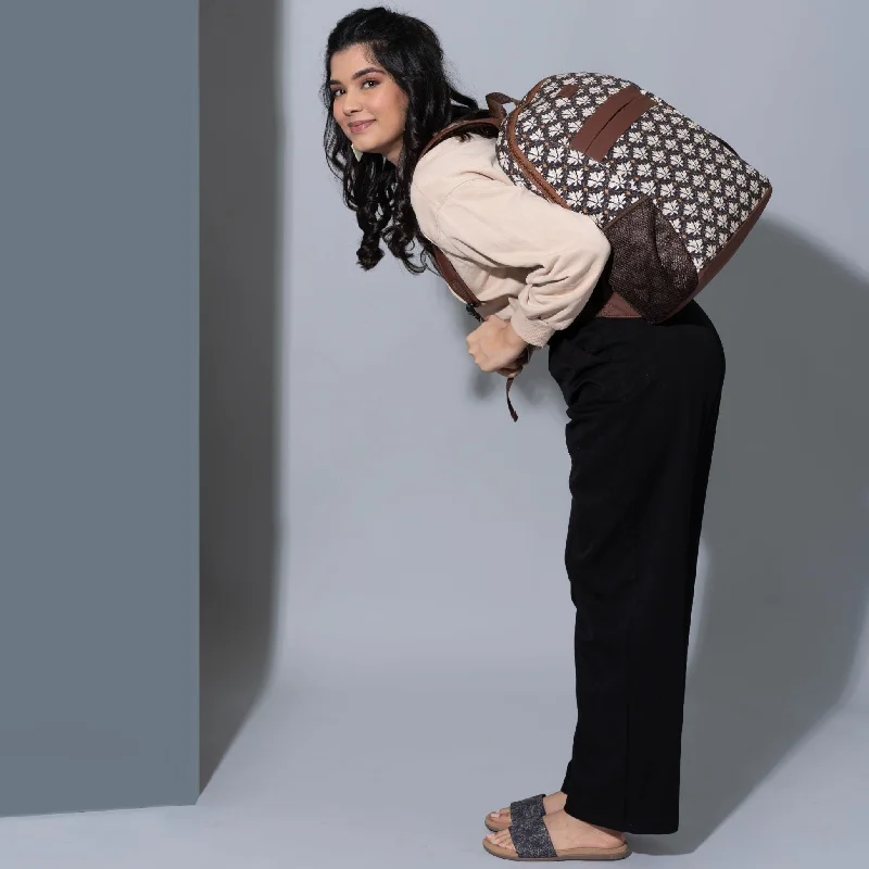 Leatherette backpack with a quilted texture and a magnetic snap closureBidri Kaiser Classic Backpack