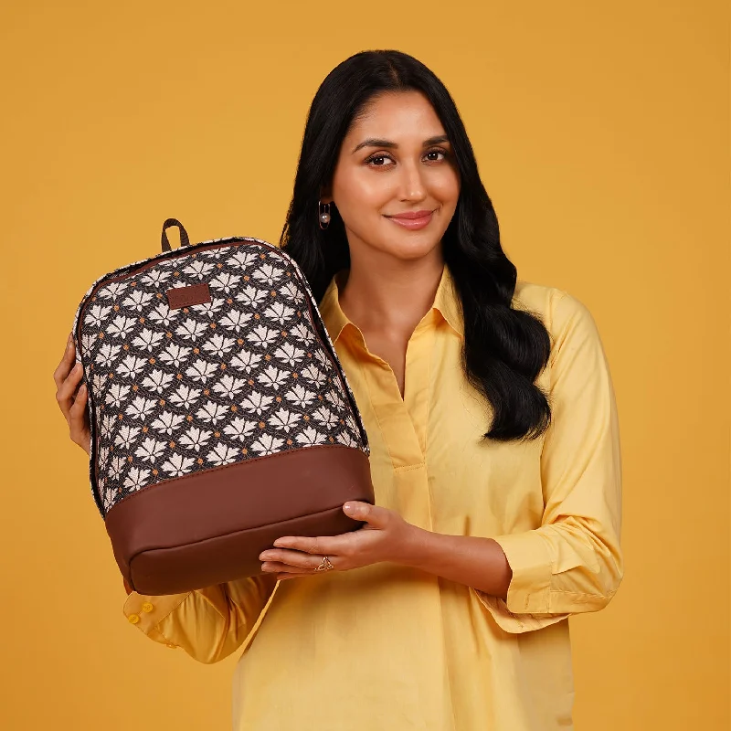 Canvas backpack with a colorful tie - dye pattern for a hippie - chic lookBidri Kaiser Dome Daypack