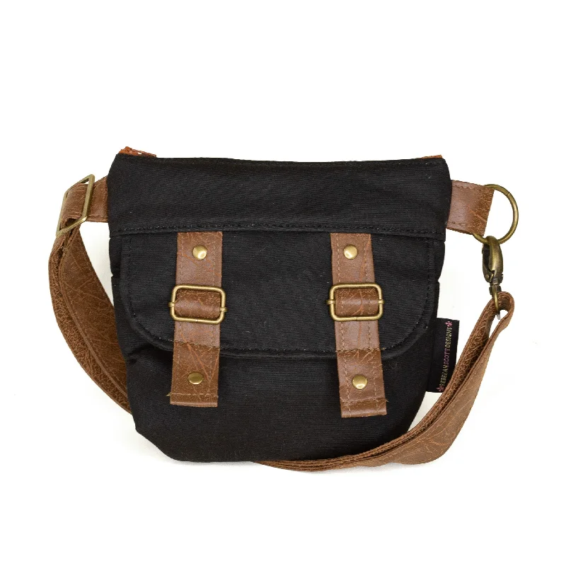 Vintage - style crossbody bag with a brass frame and leather strapsBrittany: Black Waxed Canvas