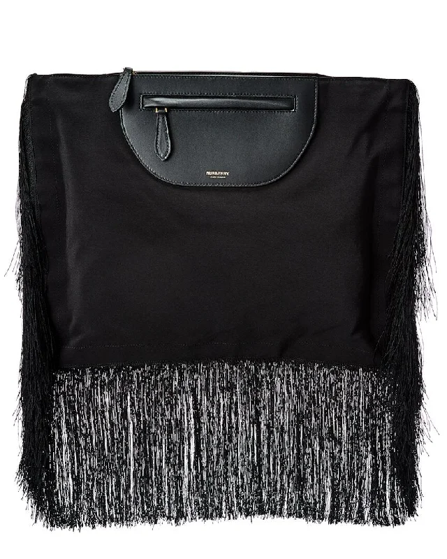 Velvet clutch with a tassel detail for a bohemian - chic styleBurberry Olympia Fringe Canvas & Leather Clutch