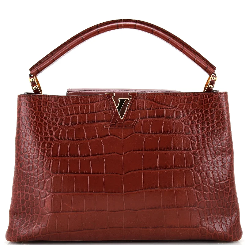 Soft suede satchel in a rich burgundy color for autumnCapucines Bag Crocodile MM