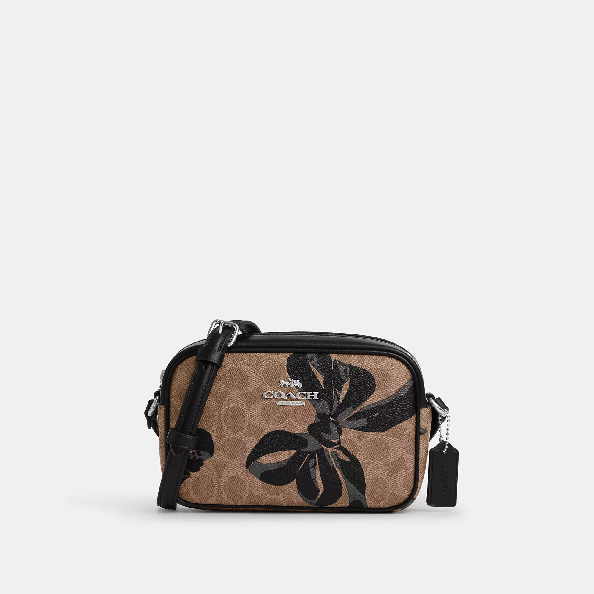 Canvas crossbody bag with a patchwork design for a casual and artsy feelCoach Outlet Mini Jamie Camera Bag In Signature Canvas With Bow Print