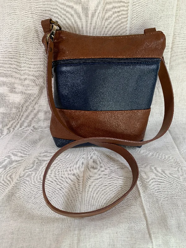 Embroidered crossbody bag with intricate beadwork for a unique touchCognac and navy blue classic striped all leather crossbody.