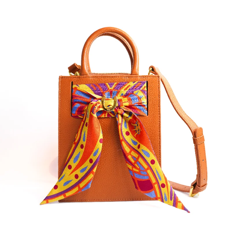 Laser - cut leather handle bag with a geometric pattern for a modern and edgy lookLeather Mini Calista + Orange Paisley Twilly