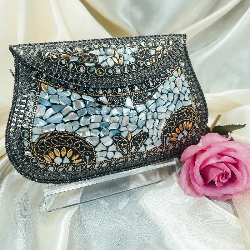 Clutch with a removable strap to be used as a hand - held or cross - bodyHEMA Mosaic Clutch