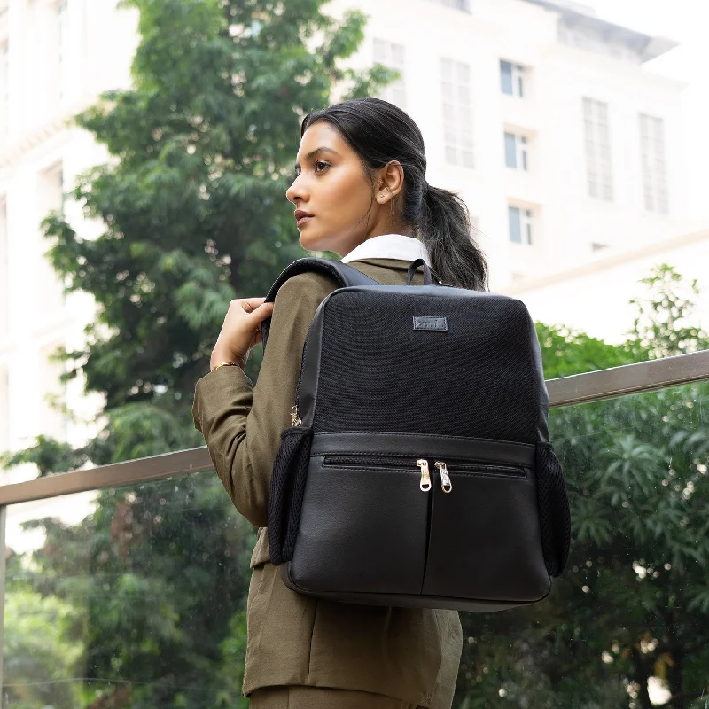 Leatherette backpack with a quilted texture and a magnetic snap closureJet Black Office Backpack