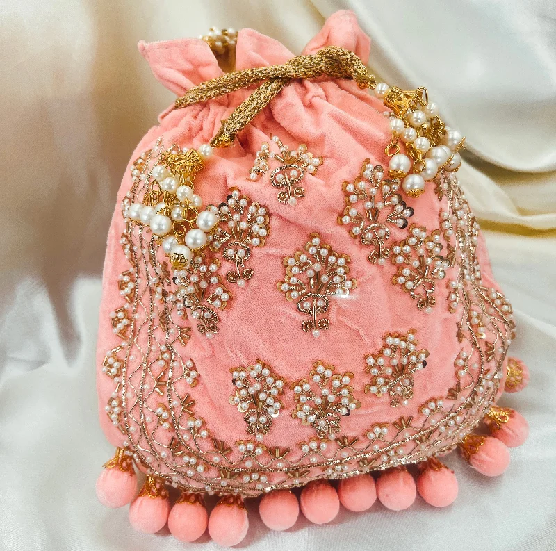 Miniature evening bag with a fold - over clasp for a compact optionLAILA Potli (Pink)