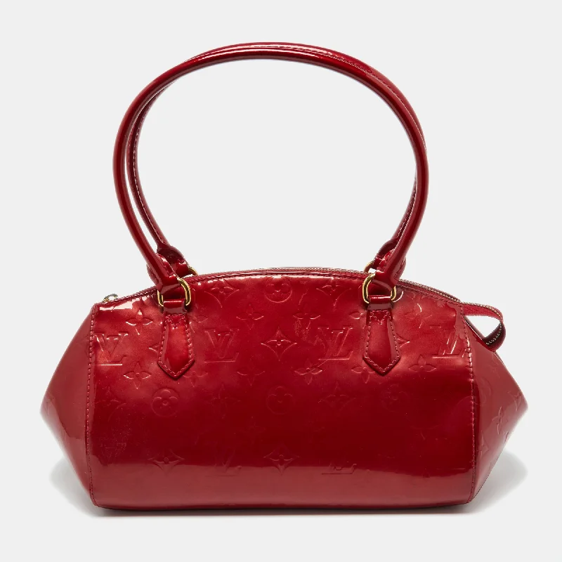 Studded satchel with a punk-rock edgeLouis Vuitton Pomme D’amour Monogram Vernis Sherwood Pm Bag