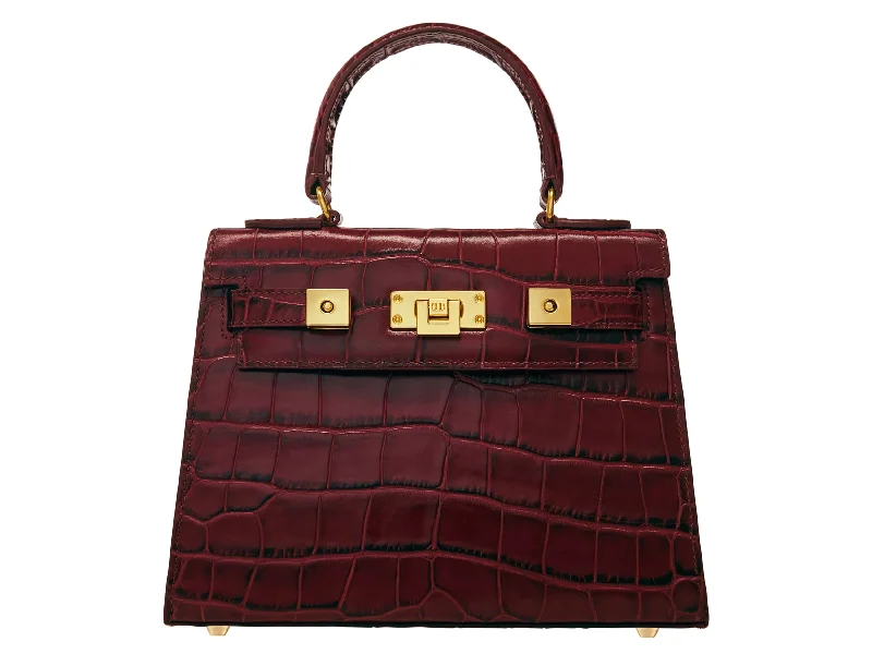 Studded leather shoulder bag with a punk - rock aestheticMaya Midi Orinoco - Wine