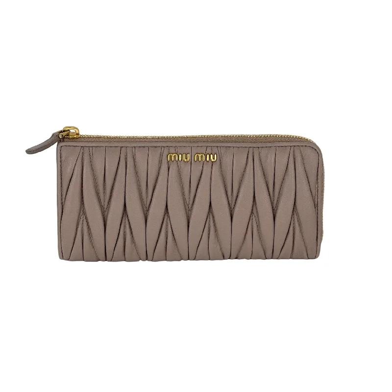 Mother - of - pearl clutch with a delicate sheenMiu Miu Long Beige Zip Around Leather Wallet