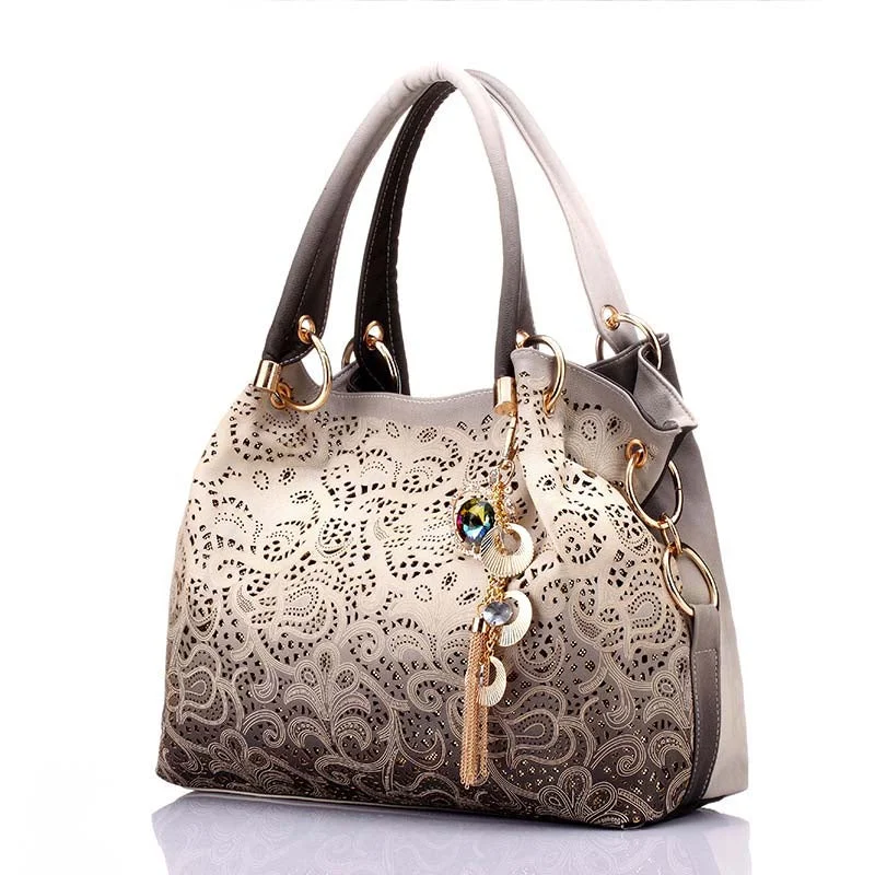 Women's large capacity cotton duffel bags for travelNew Women's Vintage Hobo Floral Hollow Out Shoulder Bags Ladies PU Leather Polyester Tote Bag with Tassel