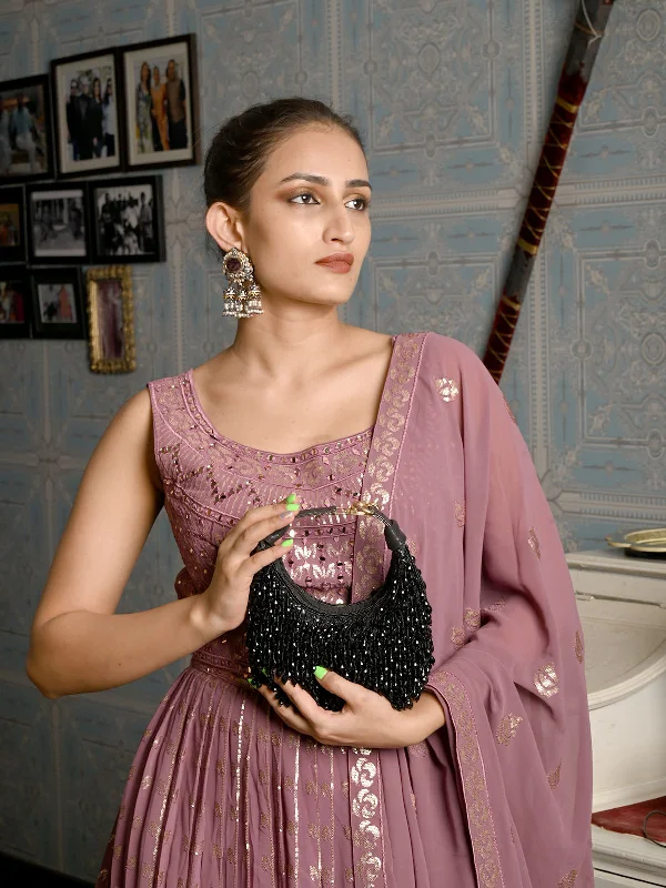 Patent leather clutch with a modern, minimalist designOdette Black Beaded Moon Clutch For Women