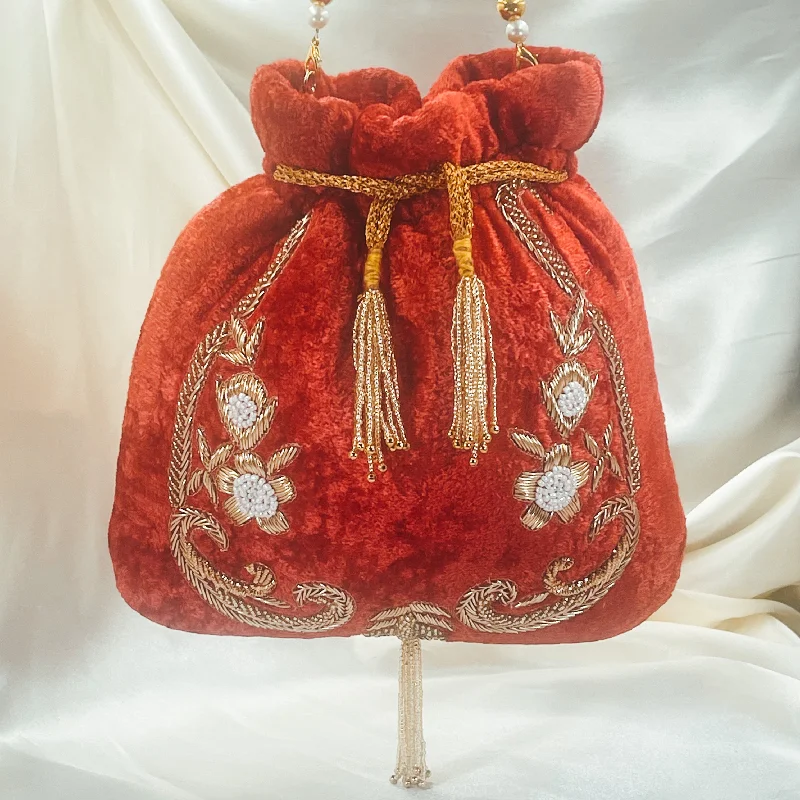 Mother - of - pearl clutch with a delicate sheenPRIYA Potli (Red)