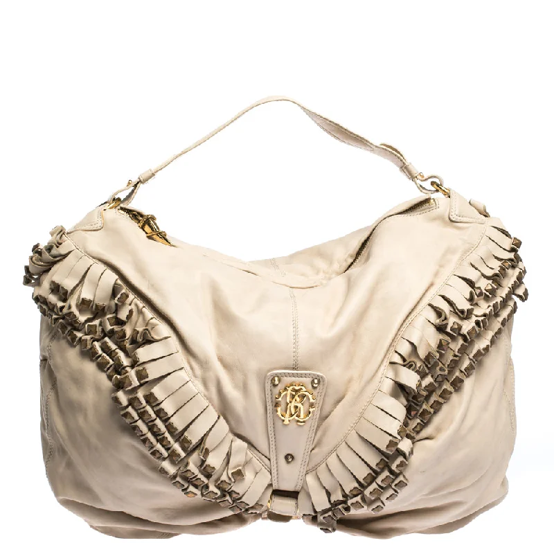 Metallic satchel with a shiny finish for evening eventsRoberto Cavalli Cream Leather Studded Fringe Hobo