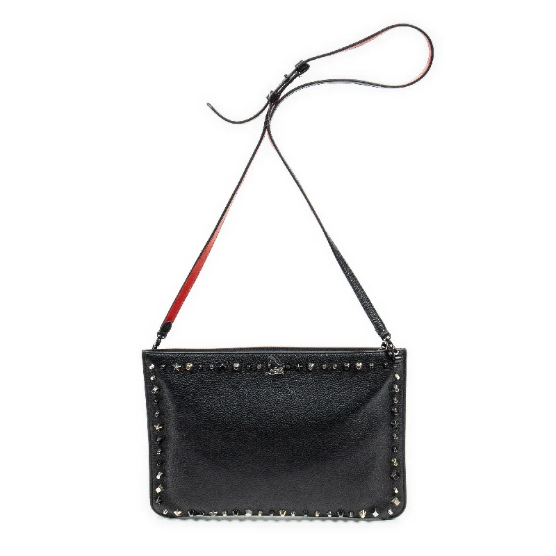 Clutch with a removable strap to be used as a hand - held or cross - bodyStudded Zip Clutch Crossbody