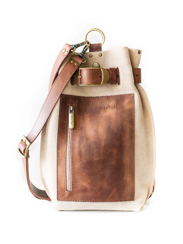 Crossbody bag with multiple compartments and pockets for organizationTaupe Suede Sling Backpack