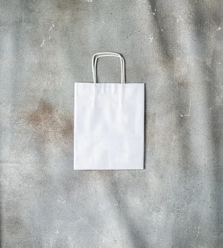 Vintage - style leather handle bag with a structured silhouette and a tassel charmTwisted Handle Kraft Paper Bag - White 180x80x225mm