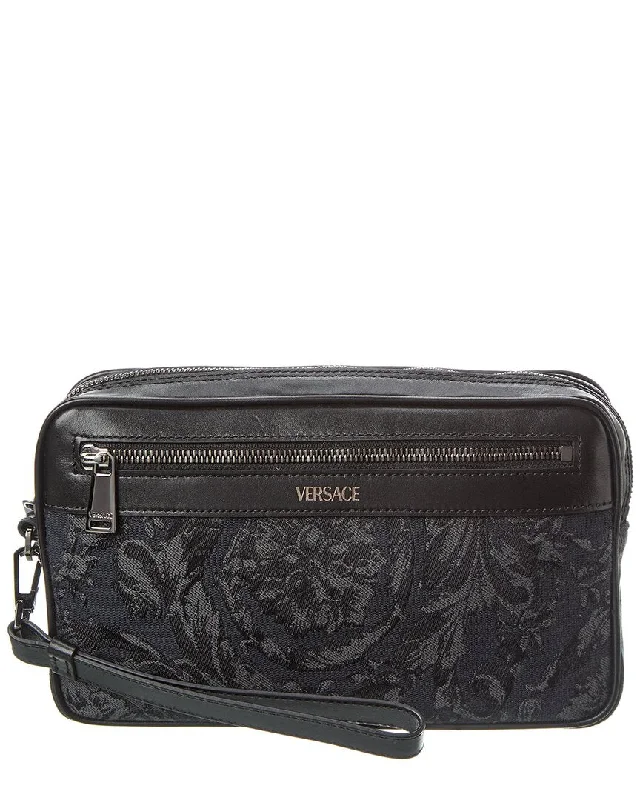 Clutch with a removable strap to be used as a hand - held or cross - bodyVersace Barocco Jacquard & Leather Pouch